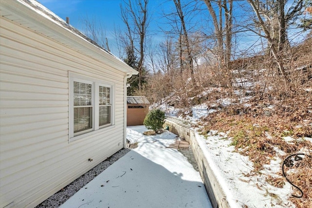 view of yard layered in snow