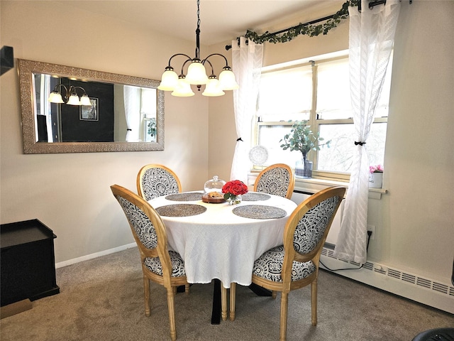 carpeted dining space featuring a baseboard heating unit, an inviting chandelier, and baseboards