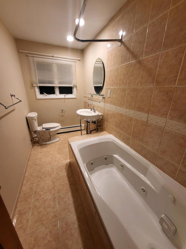 full bathroom featuring tiled shower / bath combo, tile patterned flooring, toilet, baseboard heating, and sink