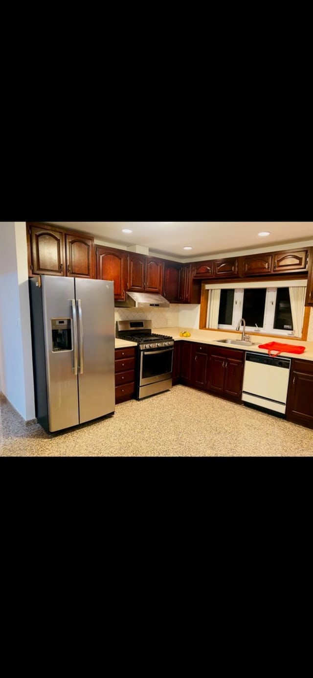 kitchen with sink and appliances with stainless steel finishes