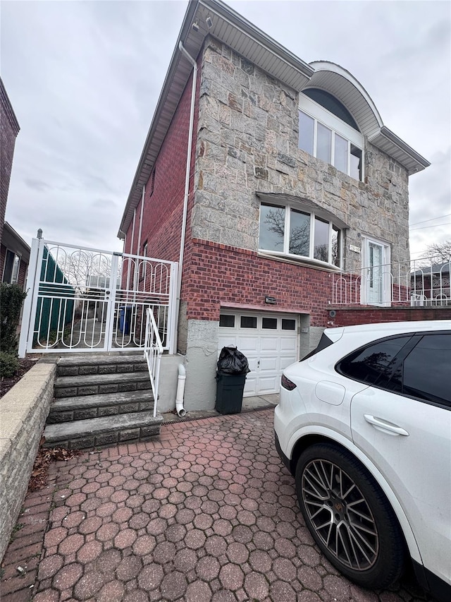 view of side of home with a garage