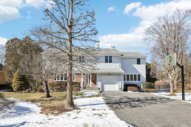 traditional-style home with aphalt driveway