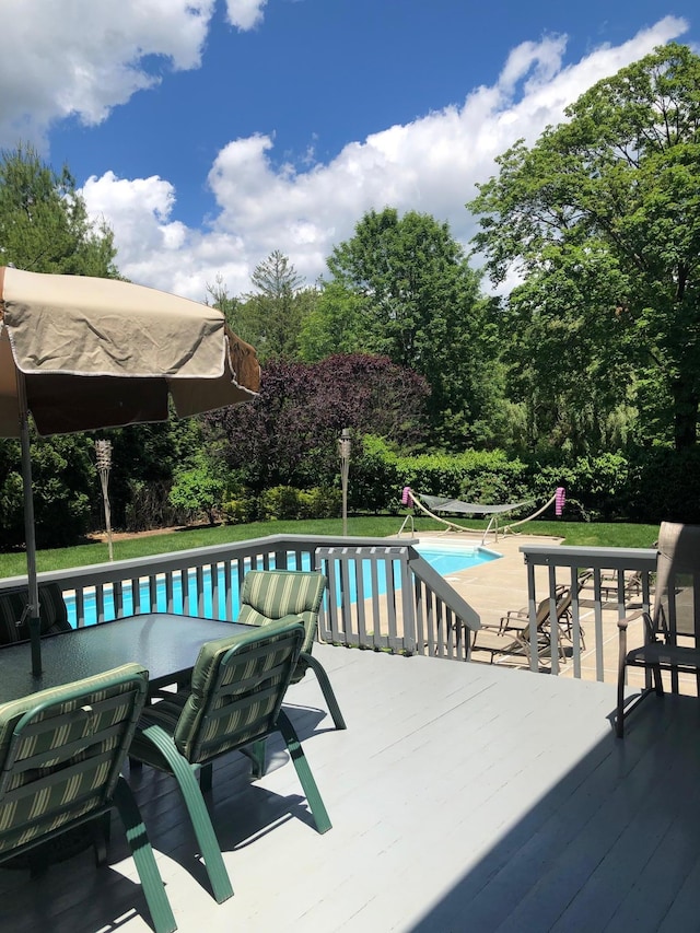 outdoor pool with a patio area