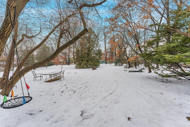 view of yard layered in snow