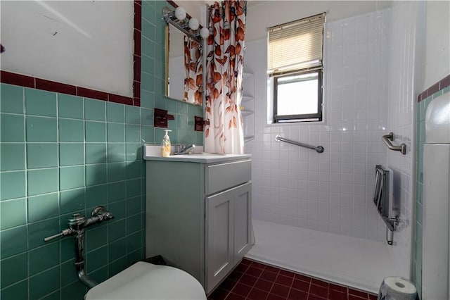 bathroom featuring tile walls, vanity, a shower with curtain, and toilet