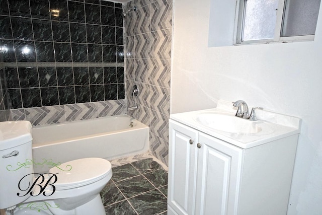 full bathroom featuring tiled shower / bath combo, toilet, and vanity