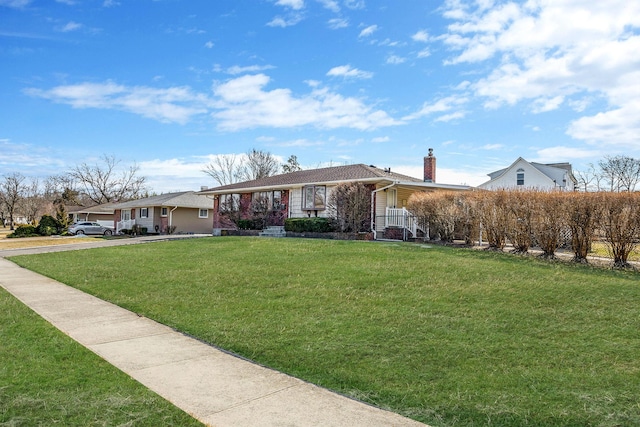 ranch-style house with a chimney and a front lawn