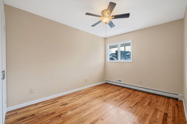 unfurnished room with light wood finished floors, a baseboard radiator, baseboards, and a ceiling fan