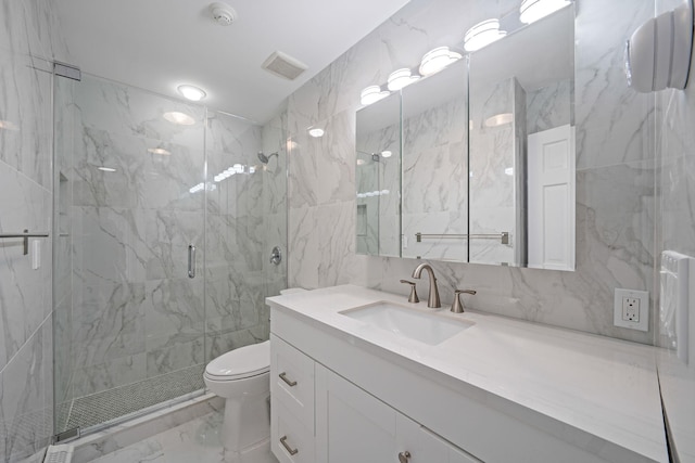 full bathroom with toilet, vanity, visible vents, marble finish floor, and a marble finish shower