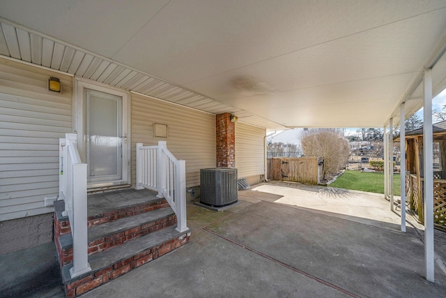 view of patio featuring fence and cooling unit