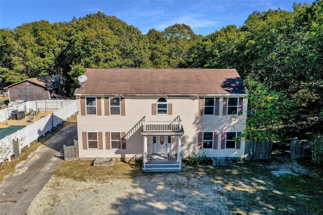 colonial house featuring covered porch