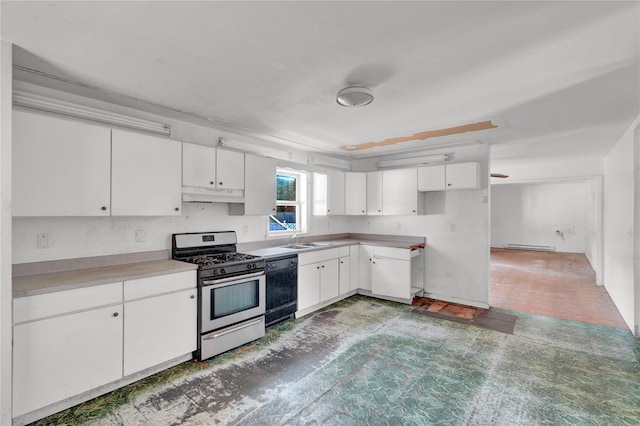 kitchen with dishwasher, baseboard heating, stainless steel gas stove, sink, and white cabinetry