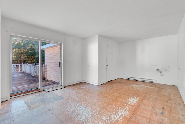 unfurnished room featuring baseboard heating and light parquet flooring