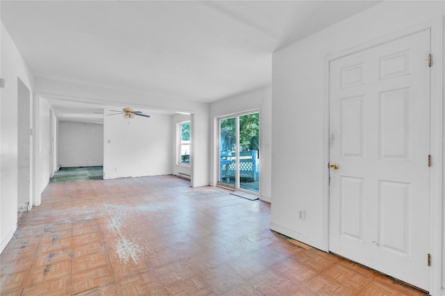 unfurnished room featuring ceiling fan and light parquet flooring