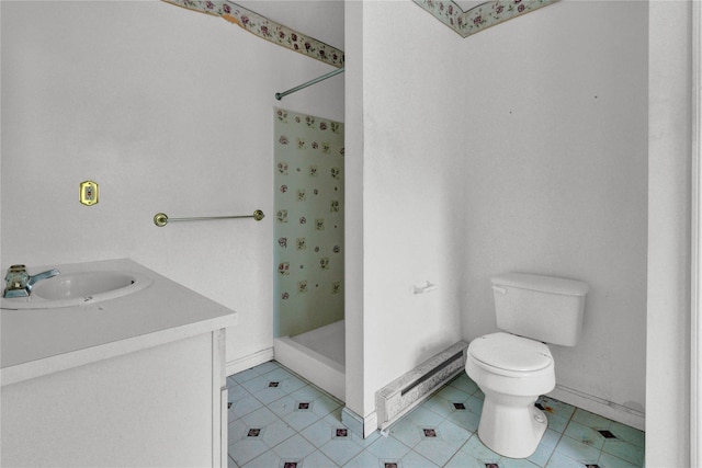 bathroom featuring a shower, vanity, toilet, and tile patterned flooring