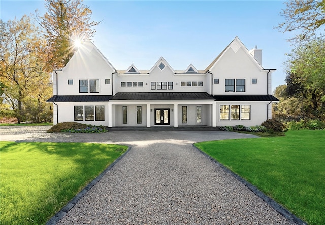 modern farmhouse featuring a front lawn