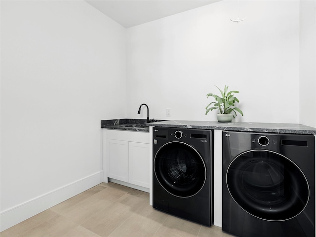 110 Crescent Ct, Wading River, NY 11792 - laundry room featuring washing machine and clothes dryer, cabinet space, and baseboards