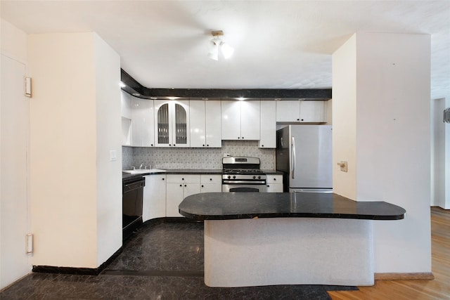 kitchen featuring white cabinetry, stainless steel appliances, backsplash, and kitchen peninsula