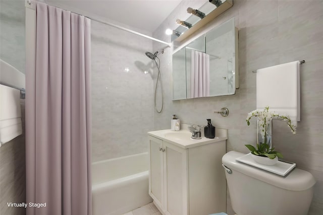 full bathroom featuring tile walls, vanity, toilet, and shower / bath combo with shower curtain