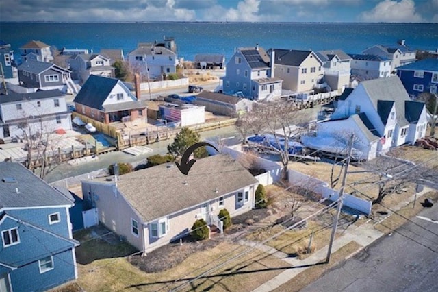 birds eye view of property with a residential view