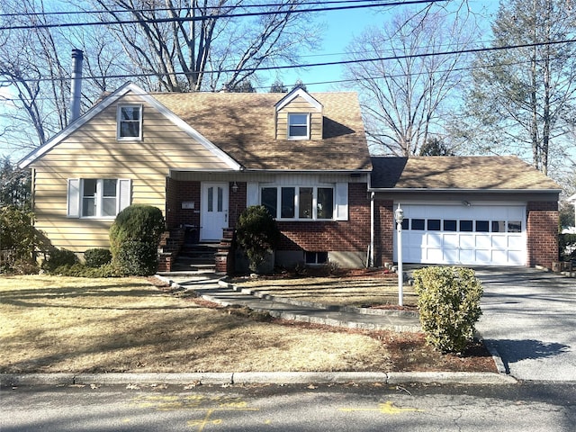 cape cod-style house with a garage