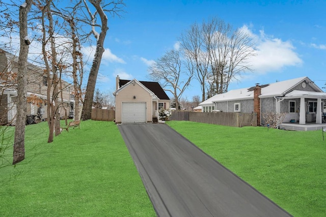 view of front facade with a front yard and a garage