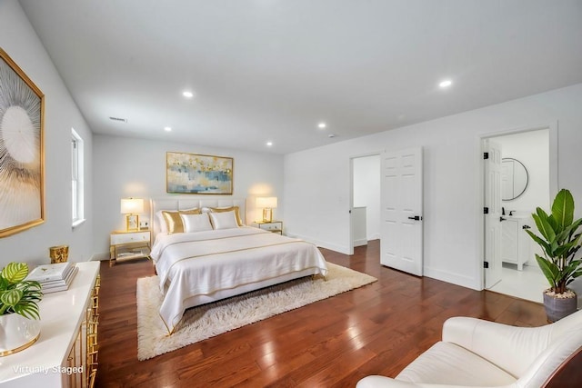 bedroom with dark wood-type flooring