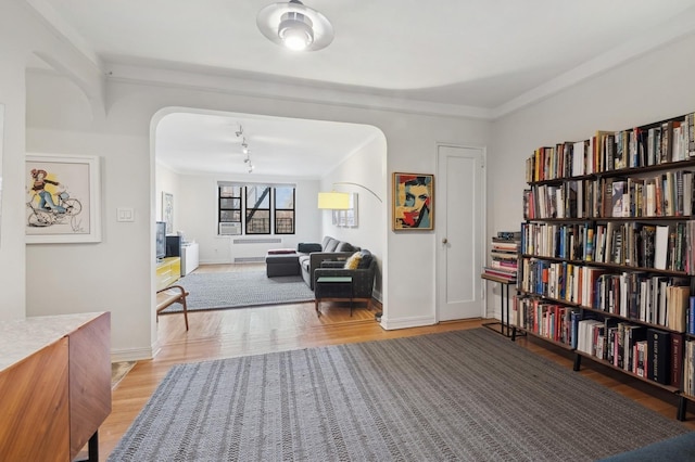 interior space featuring light wood finished floors and baseboards