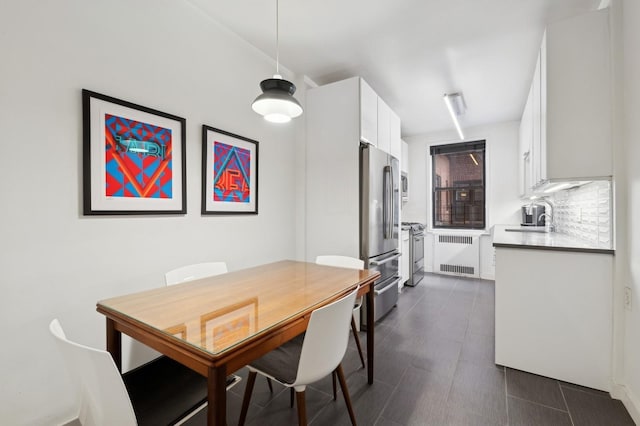 dining room with radiator