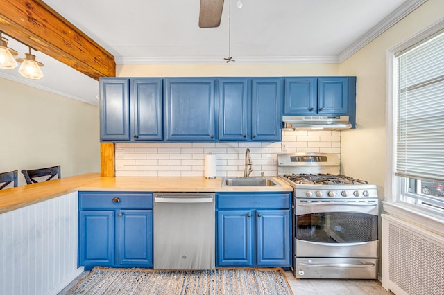 kitchen featuring a sink, stainless steel appliances, light countertops, and under cabinet range hood