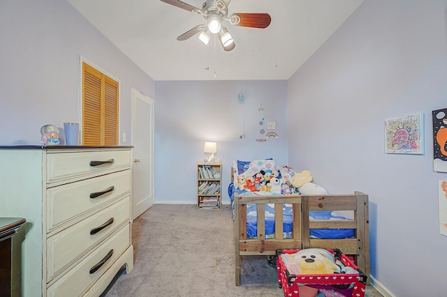 bedroom with baseboards, ceiling fan, and light colored carpet