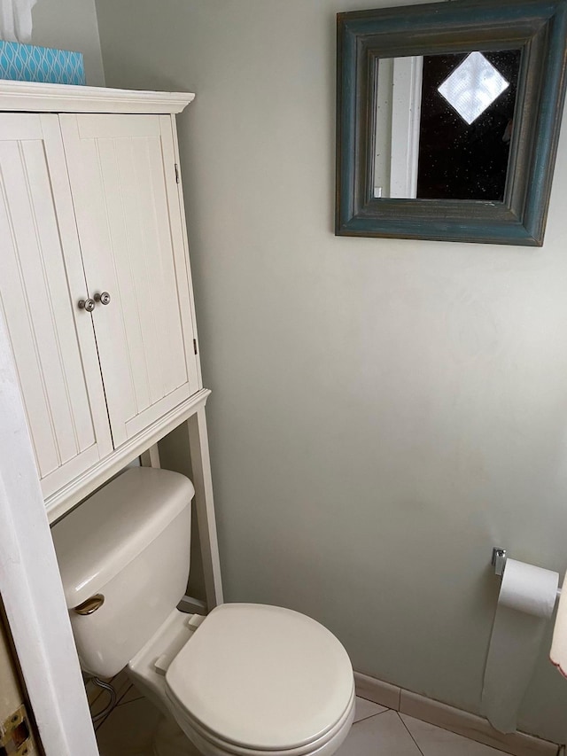 bathroom featuring tile patterned floors and toilet