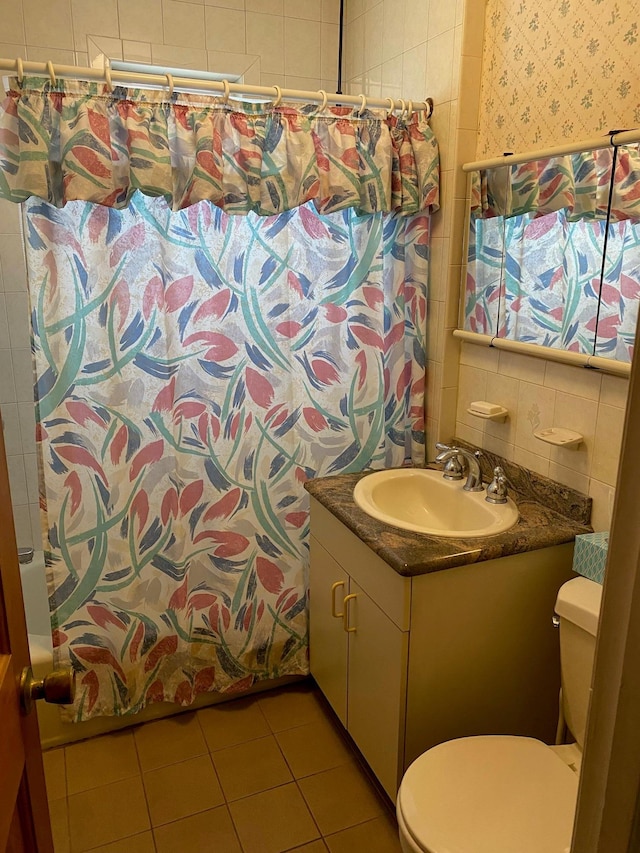 full bathroom with backsplash, vanity, shower / bath combination with curtain, toilet, and tile patterned floors