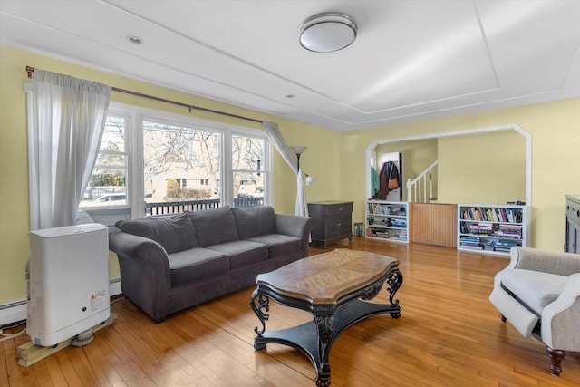 living area with hardwood / wood-style floors