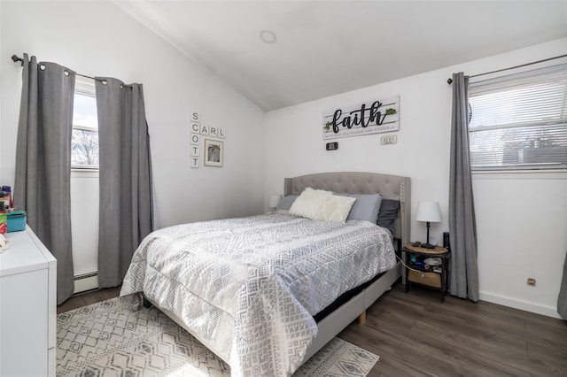 bedroom featuring a baseboard heating unit, lofted ceiling, and dark hardwood / wood-style floors