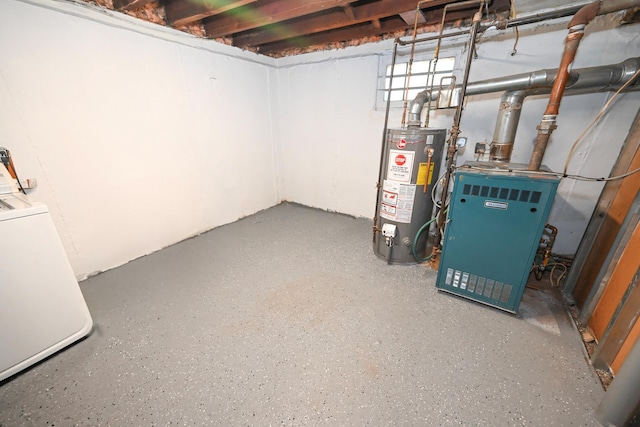 below grade area featuring washer / dryer and water heater