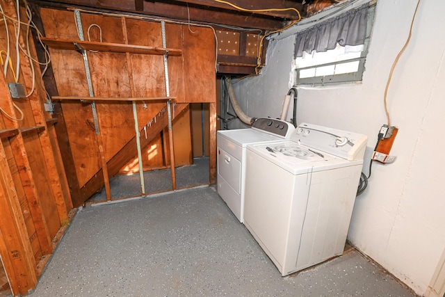 clothes washing area featuring laundry area and washer and dryer