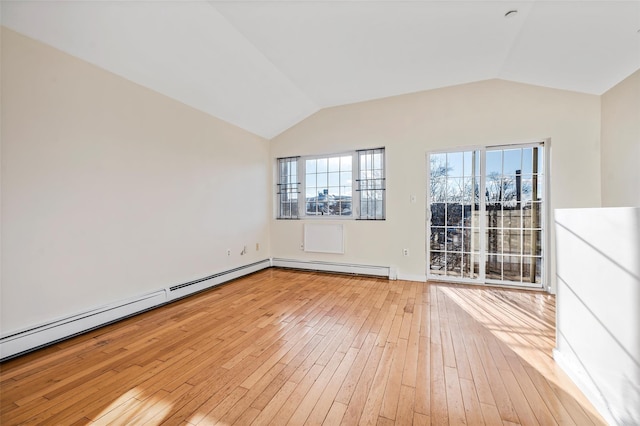 unfurnished room with baseboard heating, light hardwood / wood-style floors, and lofted ceiling