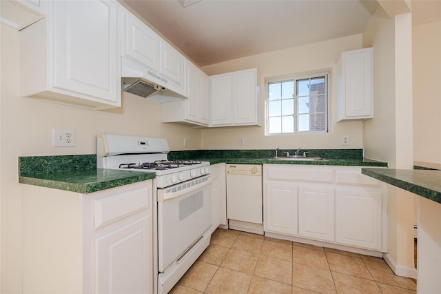 kitchen with white appliances, sink, light tile patterned flooring, and white cabinets