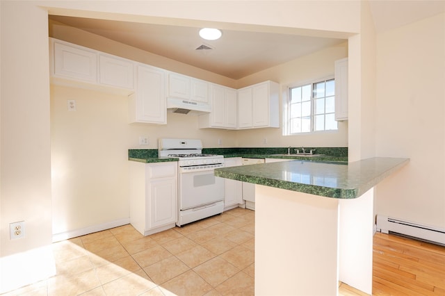 kitchen with white appliances, white cabinets, light tile patterned floors, sink, and kitchen peninsula