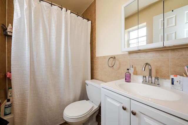 bathroom featuring tile walls, toilet, vanity, and a shower with shower curtain