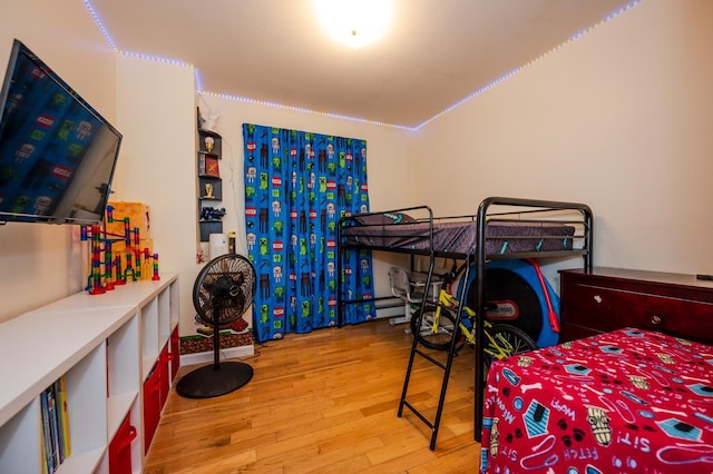 bedroom with hardwood / wood-style flooring