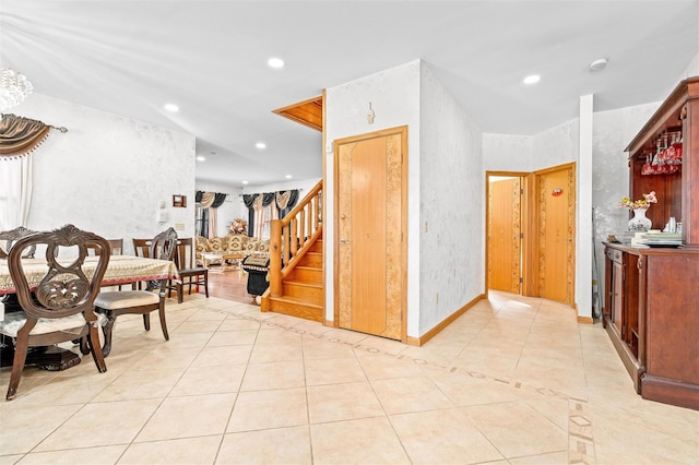 interior space with stairs, light tile patterned flooring, and recessed lighting