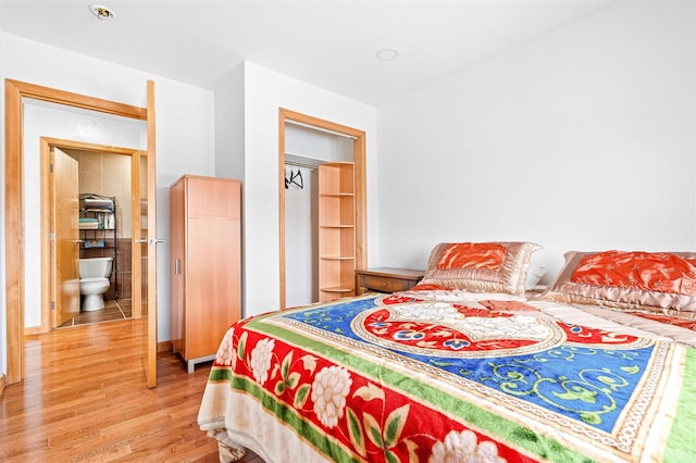 bedroom with wood finished floors