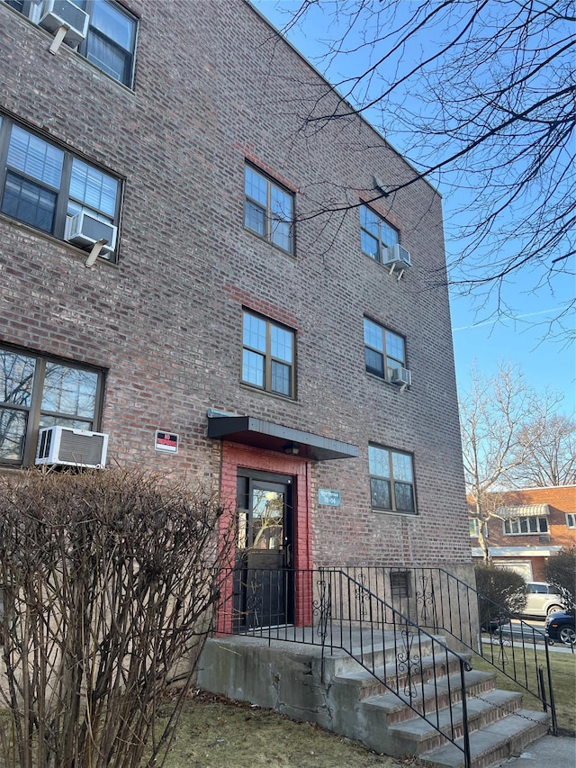 view of building exterior with cooling unit