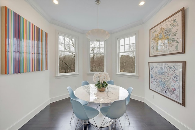 dining room with plenty of natural light, baseboards, and ornamental molding