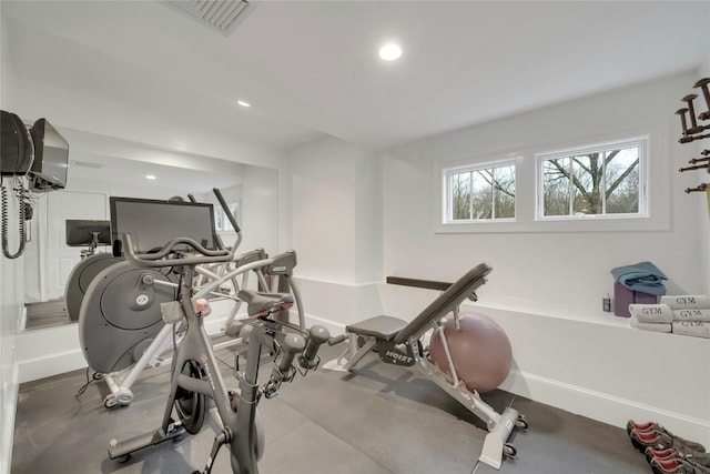 workout area featuring visible vents, recessed lighting, and baseboards