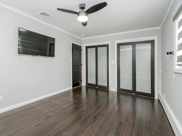 unfurnished bedroom featuring dark hardwood / wood-style flooring, two closets, crown molding, and a baseboard radiator