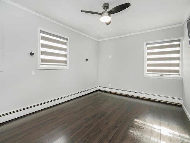 empty room featuring ornamental molding, dark wood-type flooring, and a wealth of natural light