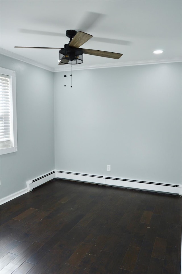 spare room featuring ceiling fan, crown molding, and dark hardwood / wood-style floors